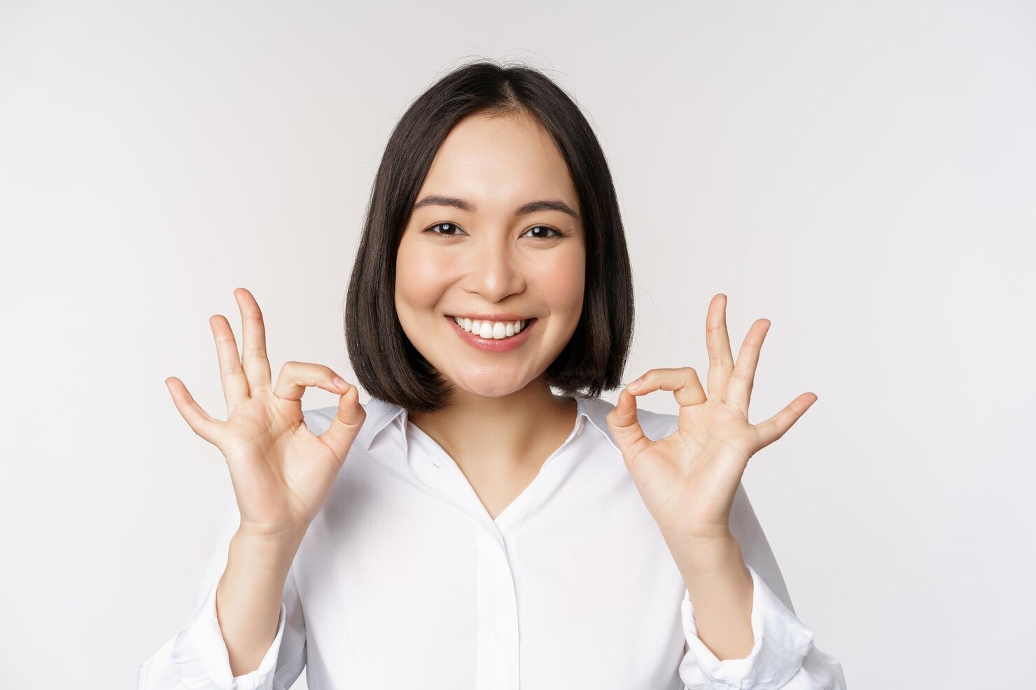 close-up-head-portrait-asian-girl-showing-okay-ok-sign-smiling-satisfied-recommending-being-pleased-praise-make-compliment-white-background_1258-89128